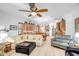 Bright open-concept living room, white walls, wood floors, and seamlessly connects to the kitchen at 14302 W Laurel Ln, Surprise, AZ 85379
