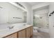 Bright bathroom features a double sink vanity and glass-enclosed shower at 15225 N 100Th St # 2210, Scottsdale, AZ 85260