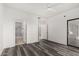 Bright bedroom features wood-look floors and access to the en suite bathroom at 15225 N 100Th St # 2210, Scottsdale, AZ 85260