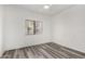 Cozy bedroom boasts wood-look floors and a bright window at 15225 N 100Th St # 2210, Scottsdale, AZ 85260