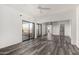Bright bedroom boasts a ceiling fan, sliding glass door, and mirrored closet at 15225 N 100Th St # 2210, Scottsdale, AZ 85260