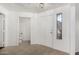 Bright entryway with tile flooring, featuring a front door and a glimpse of the powder room at 15225 N 100Th St # 2210, Scottsdale, AZ 85260