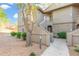 Attractive condo exterior features desert landscaping, private patio, and convenient stair access at 15225 N 100Th St # 2210, Scottsdale, AZ 85260