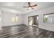 Bright living area featuring modern flooring, vaulted ceilings, and sliding glass doors at 15225 N 100Th St # 2210, Scottsdale, AZ 85260