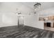 Open-concept living room with modern flooring, vaulted ceilings, and a stylish chandelier at 15225 N 100Th St # 2210, Scottsdale, AZ 85260