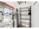 Well-organized storage space with shelving and water heater at 15225 N 100Th St # 2210, Scottsdale, AZ 85260