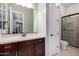 Bright bathroom features a vanity, shower, and toilet, offering a clean design at 15936 W Bonitos Dr, Goodyear, AZ 85395