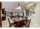 Cozy dining area with stylish furniture and a view of the living space and kitchen at 15936 W Bonitos Dr, Goodyear, AZ 85395