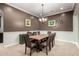Spacious dining room featuring an elegant chandelier and a large wooden table with seating for ten at 15936 W Bonitos Dr, Goodyear, AZ 85395