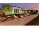 Well-maintained home with manicured lawn, landscape lighting and stone accents at 15936 W Bonitos Dr, Goodyear, AZ 85395