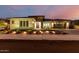 Stunning exterior of a modern home with professional landscaping and charming exterior lighting at 15936 W Bonitos Dr, Goodyear, AZ 85395