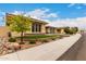 Well-kept single-story home with green lawns, desert landscaping and a welcoming curb appeal at 15936 W Bonitos Dr, Goodyear, AZ 85395