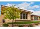 Exterior view of home with manicured front lawn, flower bed, and a two-car garage at 15936 W Bonitos Dr, Goodyear, AZ 85395
