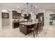 Spacious kitchen with a large island, granite countertops, and stainless steel appliances at 15936 W Bonitos Dr, Goodyear, AZ 85395
