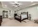 Spacious main bedroom featuring elegant decor, including decorative bed and area rug at 15936 W Bonitos Dr, Goodyear, AZ 85395