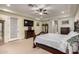 Serene main bedroom with neutral tones, a ceiling fan, and a television at 15936 W Bonitos Dr, Goodyear, AZ 85395