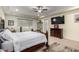 Airy main bedroom with a ceiling fan, large windows, and decorative furnishings at 15936 W Bonitos Dr, Goodyear, AZ 85395