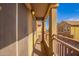 Relaxing balcony with stucco columns, offering a private outdoor area with views of nearby townhomes at 17150 N 23Rd St # 249, Phoenix, AZ 85022