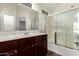 This bathroom features a shower, sliding glass doors, and a white countertop at 17150 N 23Rd St # 249, Phoenix, AZ 85022