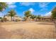 Community dog park with a sand covered play area and lush green trees nearby at 17150 N 23Rd St # 249, Phoenix, AZ 85022