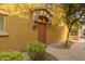 Charming townhome entrance featuring a covered porch and well-maintained landscaping at 17150 N 23Rd St # 249, Phoenix, AZ 85022