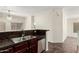 This modern kitchen features stainless steel appliances, a double sink, and granite countertops at 17150 N 23Rd St # 249, Phoenix, AZ 85022