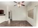 Open-concept living room featuring tile floors and a ceiling fan at 17150 N 23Rd St # 249, Phoenix, AZ 85022