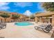 Relaxing poolside with lounge chairs and a shaded pavilion in this community pool at 17150 N 23Rd St # 249, Phoenix, AZ 85022