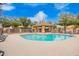 A clean community pool, featuring a shaded seating and lounging area for relaxation at 17150 N 23Rd St # 249, Phoenix, AZ 85022