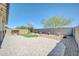 Beautiful backyard with pavers, artificial turf, desert landscaping, and a privacy wall at 18837 N Cook Dr, Maricopa, AZ 85138