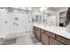Bright bathroom with a glass enclosed walk-in shower, and dual sinks at 18837 N Cook Dr, Maricopa, AZ 85138