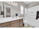 Modern bathroom featuring a walk-in shower, spacious vanity, and sleek fixtures at 18837 N Cook Dr, Maricopa, AZ 85138