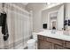 Bathroom featuring a single sink vanity with a neutral-colored shower curtain at 18837 N Cook Dr, Maricopa, AZ 85138