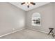 Cozy bedroom featuring carpet, ceiling fan, and a window letting in natural light at 18837 N Cook Dr, Maricopa, AZ 85138