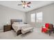 Bedroom featuring neutral walls, ceiling fan, and modern furnishings at 18837 N Cook Dr, Maricopa, AZ 85138