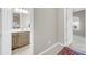 Hallway featuring modern carpet and paint with entry to the bathroom and bedroom at 18837 N Cook Dr, Maricopa, AZ 85138