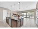 Spacious kitchen with an island, stainless steel appliances, and a view of the living area at 18837 N Cook Dr, Maricopa, AZ 85138