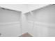 Bright walk-in closet with adjustable shelving and metal hanging rods for ample storage at 18837 N Cook Dr, Maricopa, AZ 85138