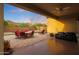 Inviting covered patio with ceiling fan, ample seating, and beautiful desert views at 2330 E Lieber Pl, Phoenix, AZ 85024