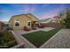 Private backyard featuring low-maintenance landscaping, artificial turf, and a covered patio at 2330 E Lieber Pl, Phoenix, AZ 85024