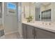 Clean bathroom featuring dual sinks, a large mirror, and neutral tones for a calming atmosphere at 2330 E Lieber Pl, Phoenix, AZ 85024