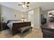 Bedroom with a wood-look tile floor, natural light, and view of the ensuite bathroom at 2330 E Lieber Pl, Phoenix, AZ 85024