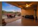 Cozy covered patio with a ceiling fan, comfortable seating, and a beautiful outdoor dining area perfect for entertaining at 2330 E Lieber Pl, Phoenix, AZ 85024