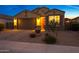 Inviting home featuring a well-lit two-car garage and desert landscaping for low-maintenance curb appeal at 2330 E Lieber Pl, Phoenix, AZ 85024