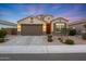 Charming single-story home featuring a well-manicured front yard, a spacious two-car garage, and a welcoming entrance at 2330 E Lieber Pl, Phoenix, AZ 85024