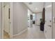 Bright hallway with a decorative mirror and natural light, connecting various rooms for seamless flow and ambiance at 2330 E Lieber Pl, Phoenix, AZ 85024