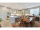 Spacious kitchen featuring granite countertops, stainless steel appliances, and a dining area for Gathering gatherings at 2330 E Lieber Pl, Phoenix, AZ 85024