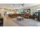 Open-concept living room and kitchen with wood-look tile floors and modern decor at 2330 E Lieber Pl, Phoenix, AZ 85024