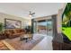 Bright living room with sliding glass doors to the patio and a view of the backyard at 2330 E Lieber Pl, Phoenix, AZ 85024