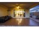Covered patio featuring comfortable seating, ceiling fan, and sliding glass doors leading to the interior of the home at 2330 E Lieber Pl, Phoenix, AZ 85024